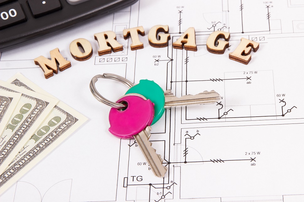 Inscription mortgage, home keys, currencies dollar and calculator on housing plan, calculations of buying or building house concept